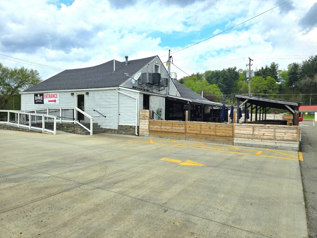 A view of the large back patio at River Rock Sports Bar & Grill in Bellville, Ohio. The entrance has a ramp suitable for wheelchair access and is handicap accessible. River Rock is a popular local restaurant.